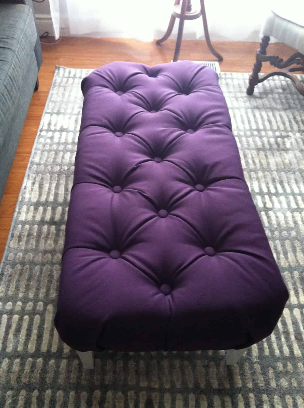 DIY purple ottoman from a coffee table