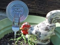 Forks and Can Lids 200x150 Keep Track of Your Plants with These Cute DIY Garden Markers