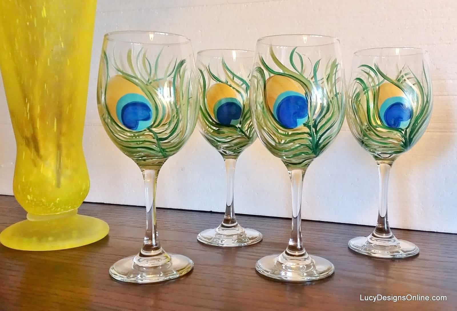 Peacock feather hand painted wine glass