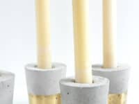 concrete candle holders 200x150 Illuminate Your Home With These Awesome DIY Candle Holders
