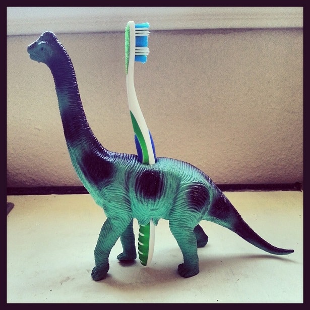 Dinosaur toothbrush holder