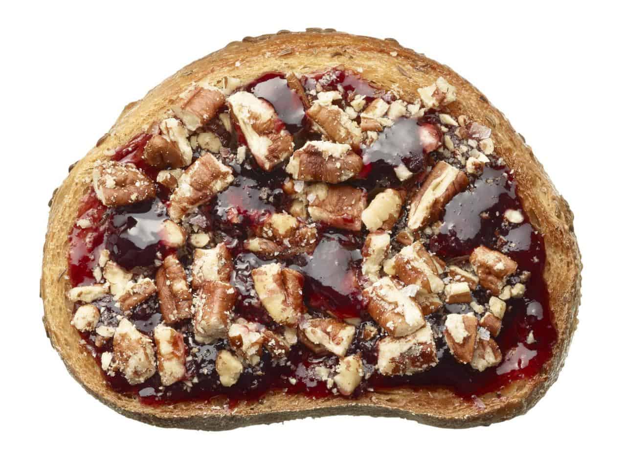 Chopped pecan and grape jelly toast