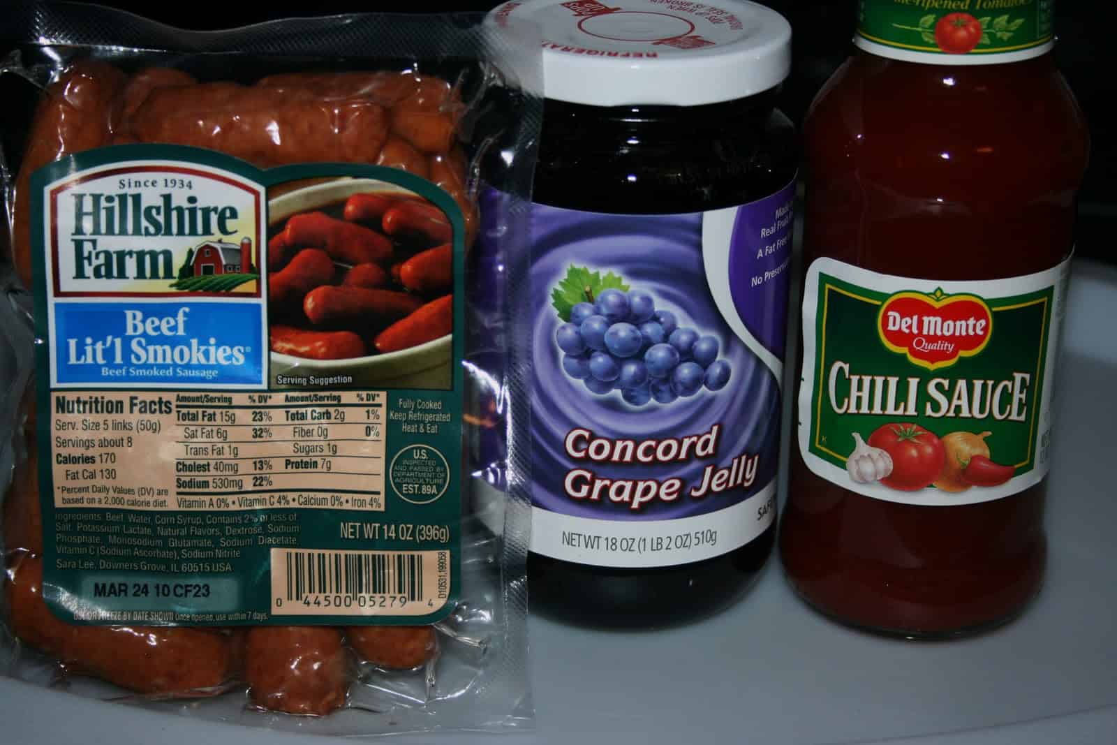Mini smoked sausages in grape jelly and chili sauce