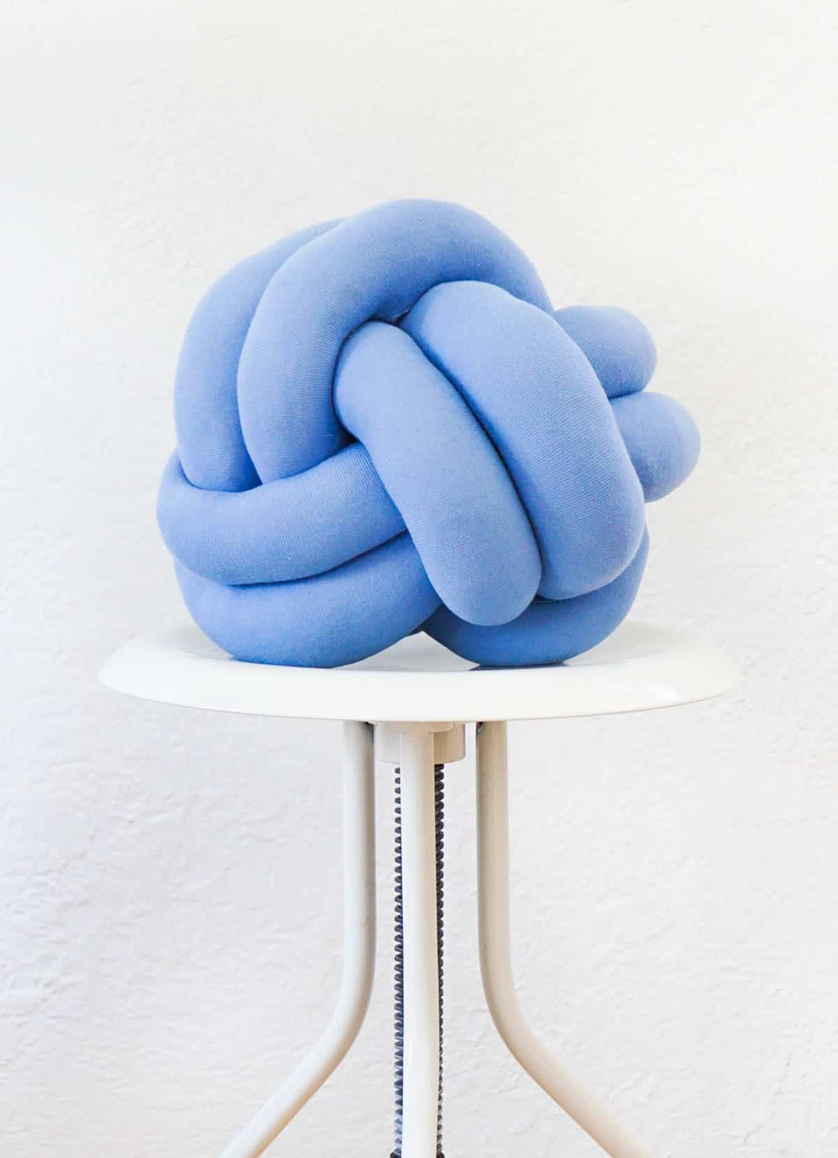 Blue fabric knot pillow