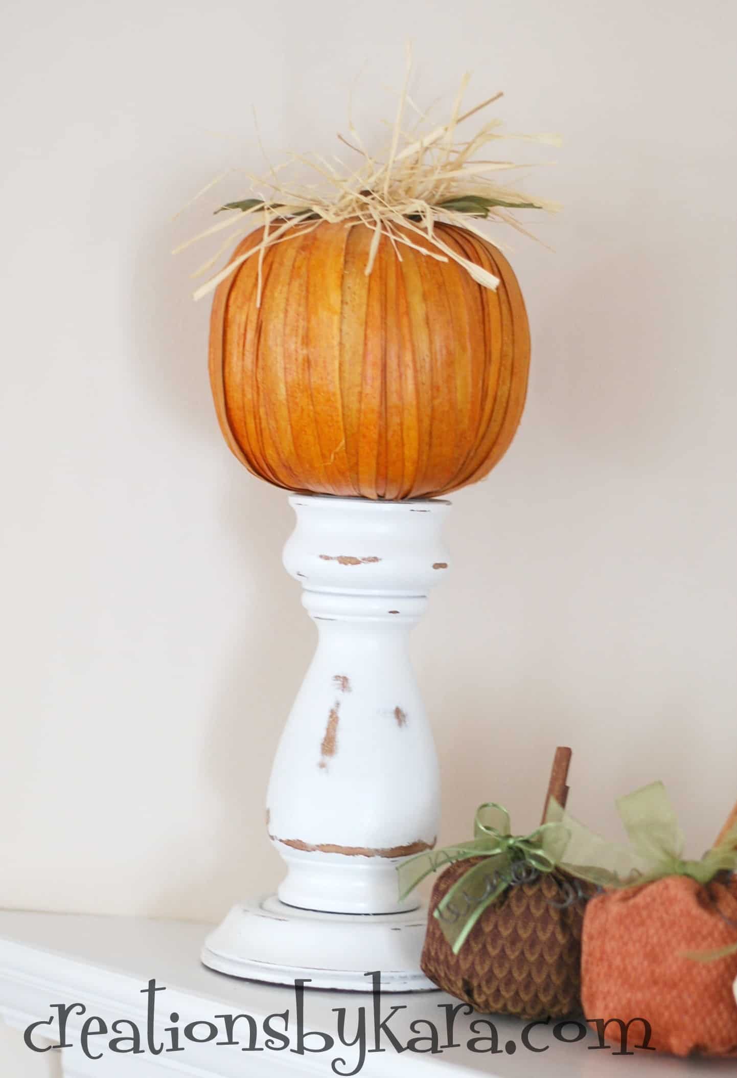 Wrapped pumkins on candle pedestals