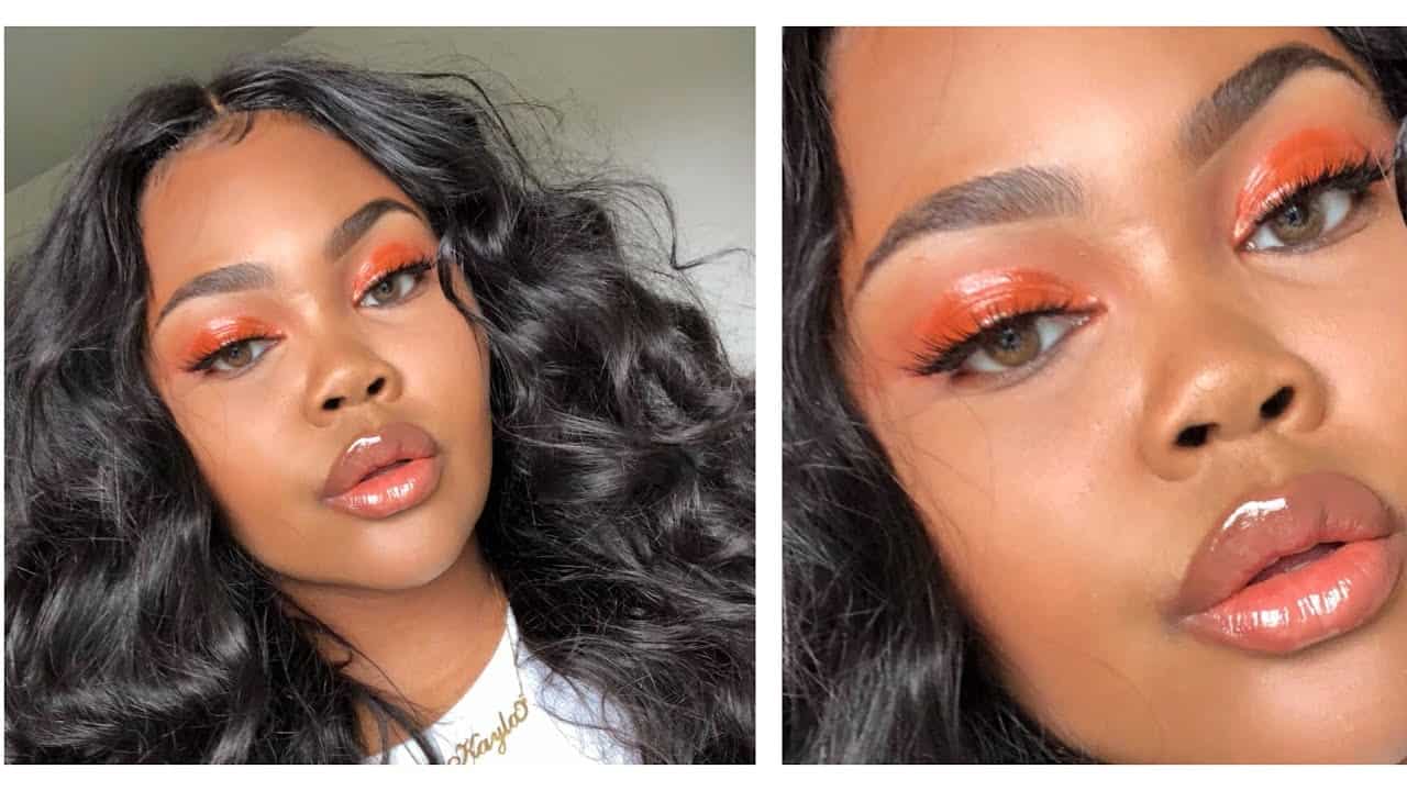 Glossy orange dark skin makeup