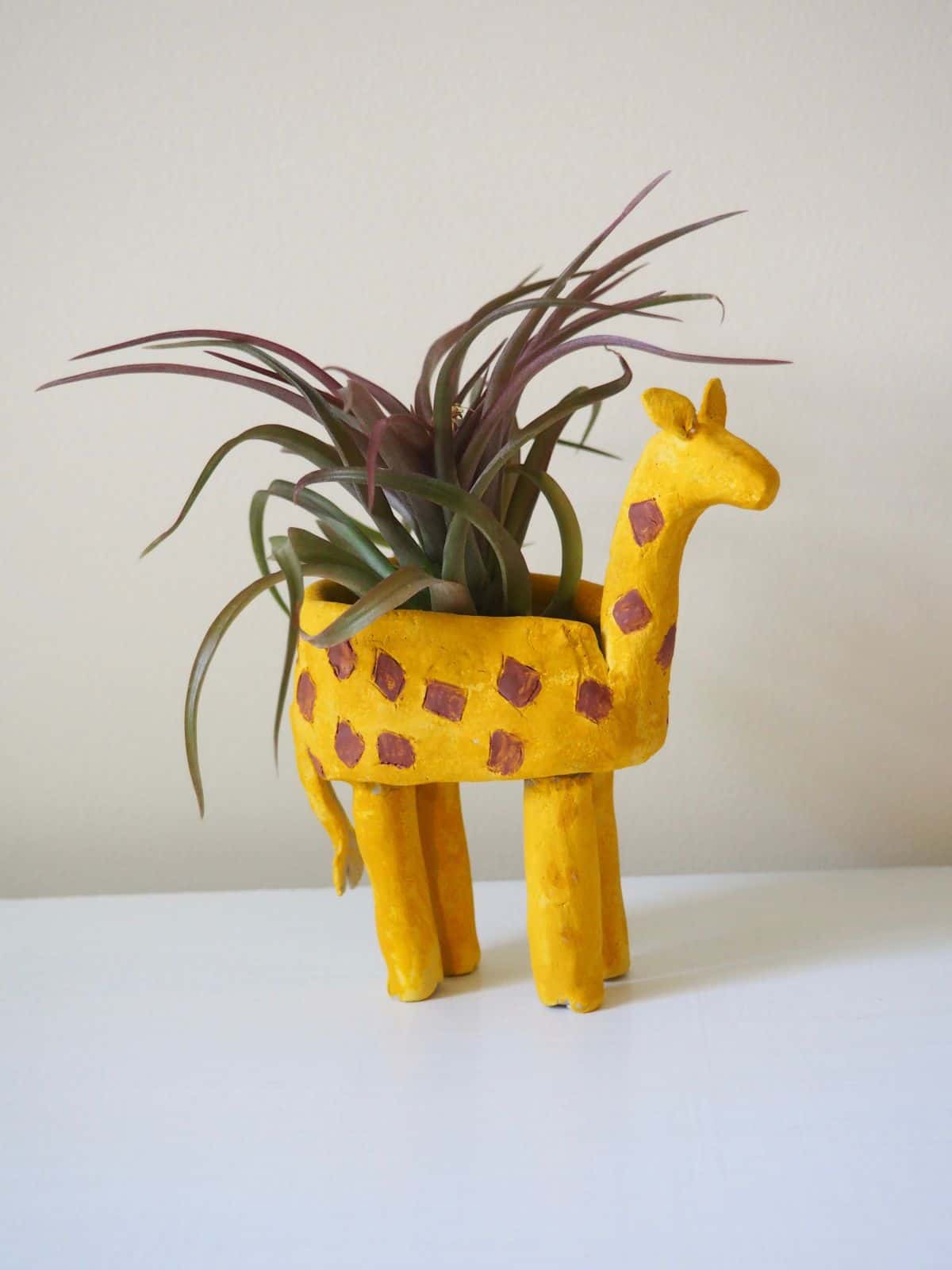 Clay giraffe planter