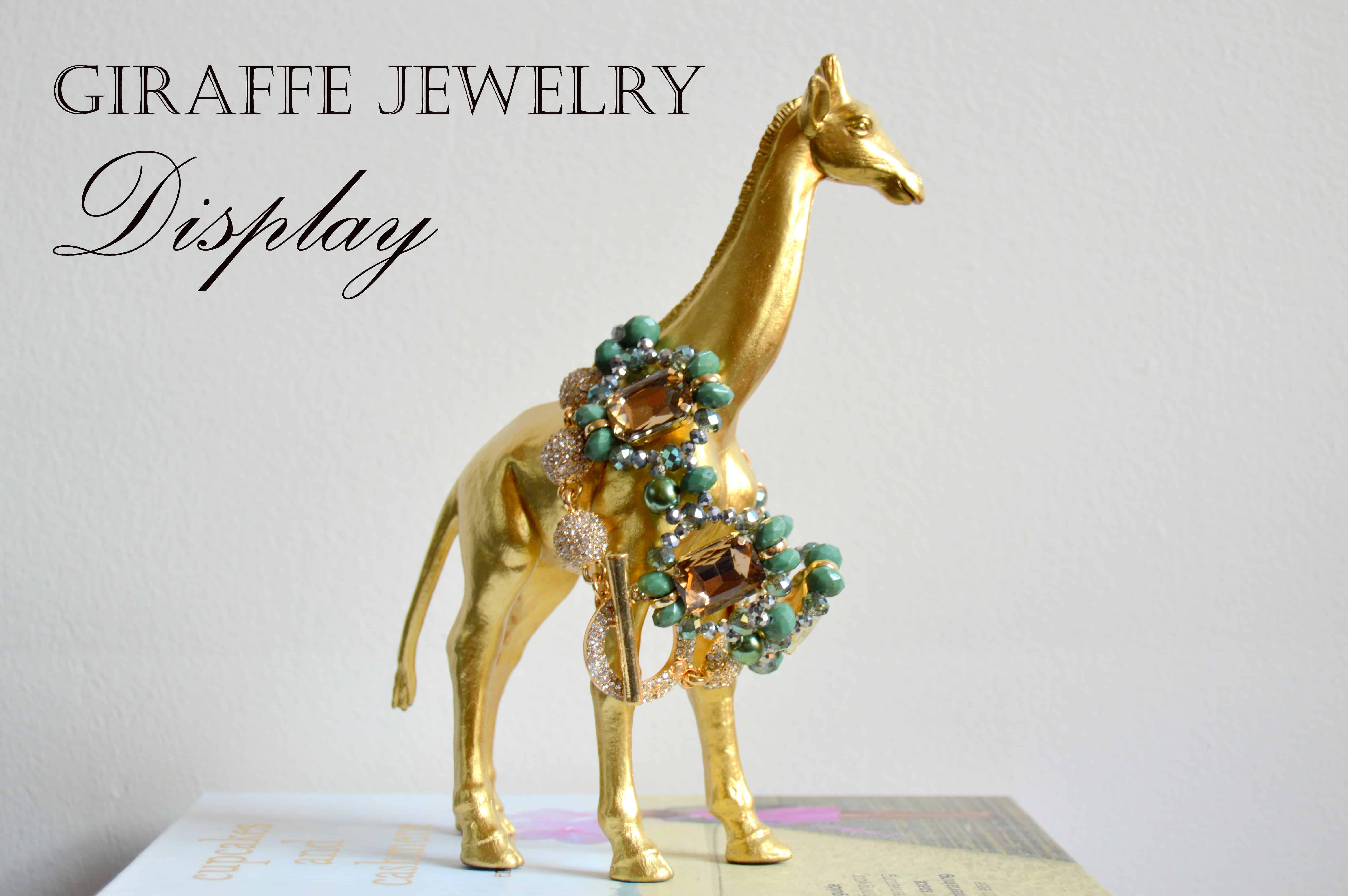 Gold painted giraffe jewelry display