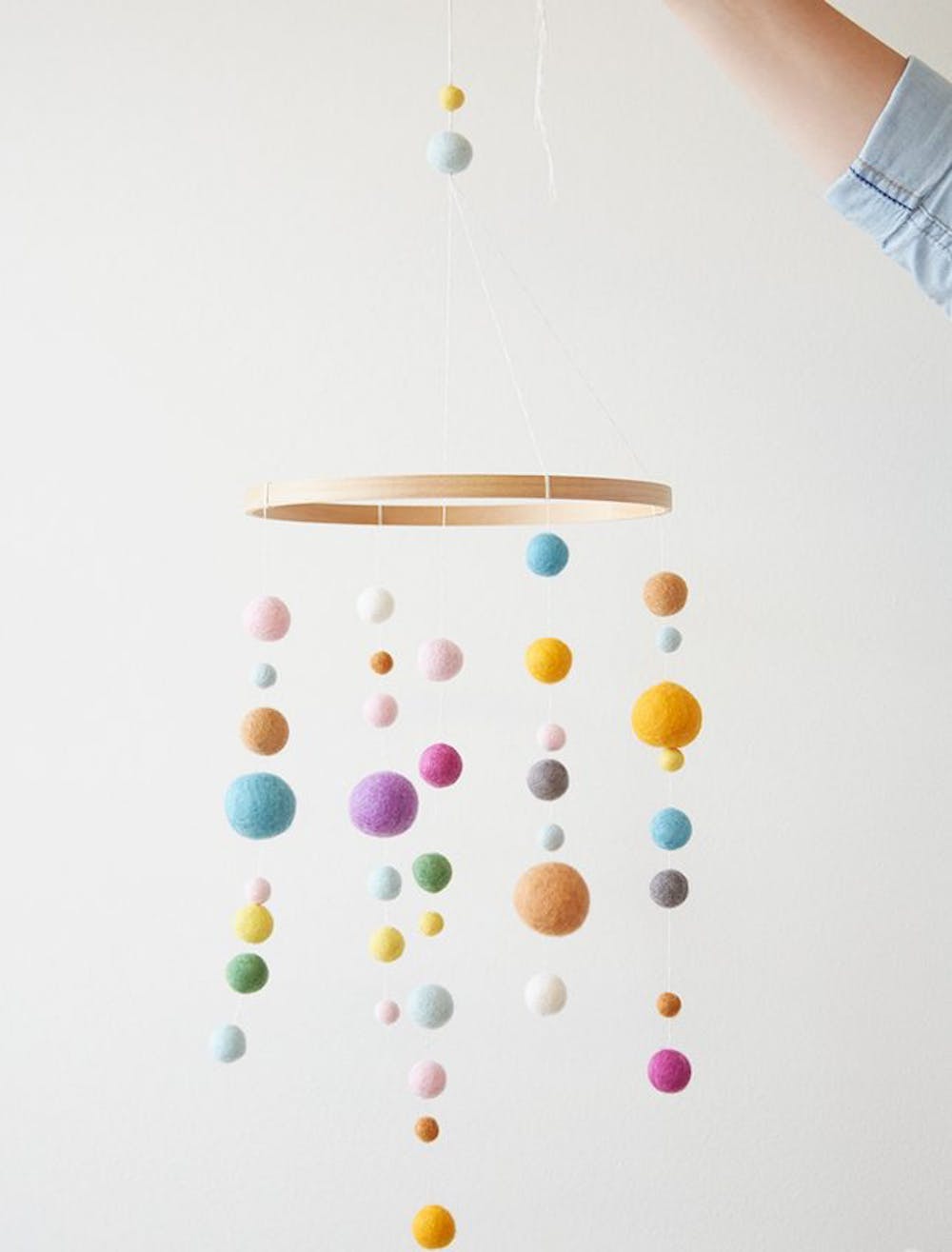 Colourful felted ball hoop mobile