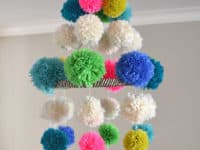 Bright pom pom chandelier 200x150 Hang em in Style: Cute DIY Mobiles for Babies Rooms