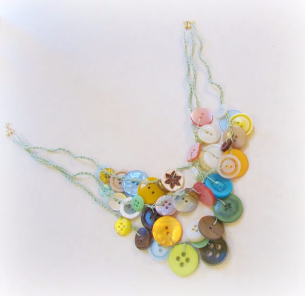 Multi-string buton necklace