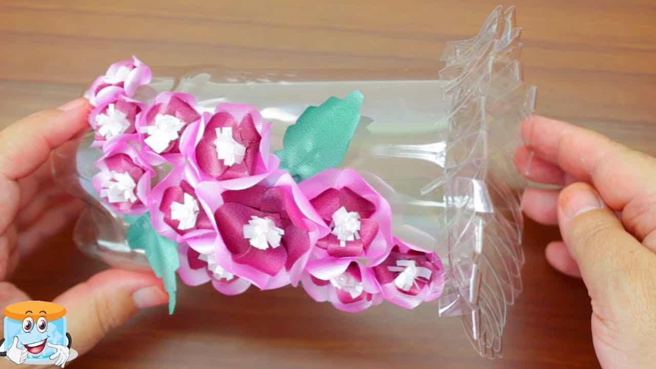 Plastic bottle and curled ribbon flower vase
