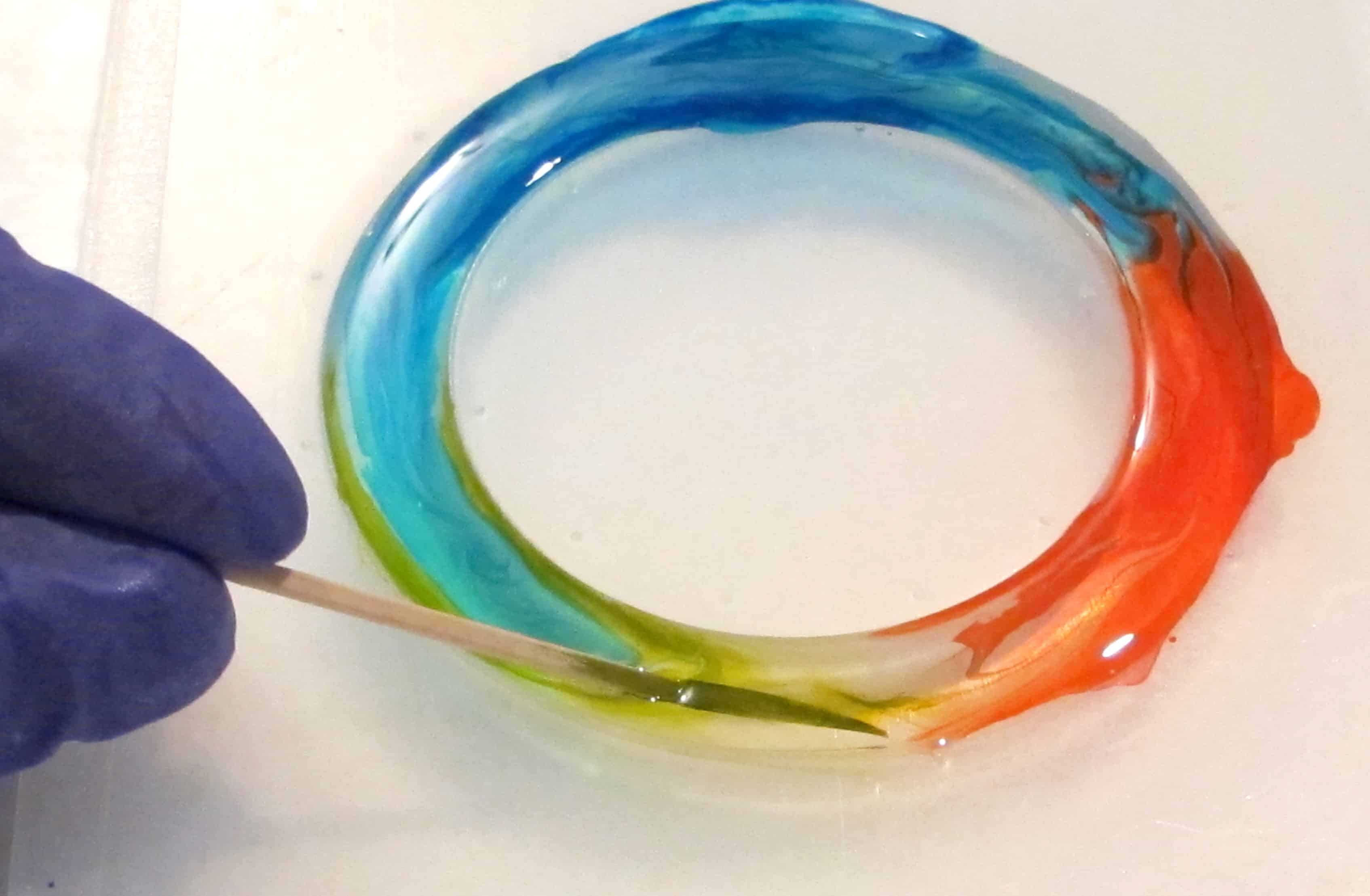 Alcohol ink and resin rainbow swirl bracelet