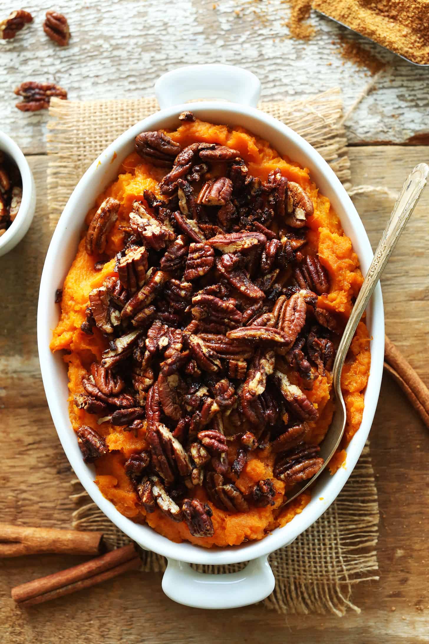 Butternut squash sweet potato casserole topped with pecans