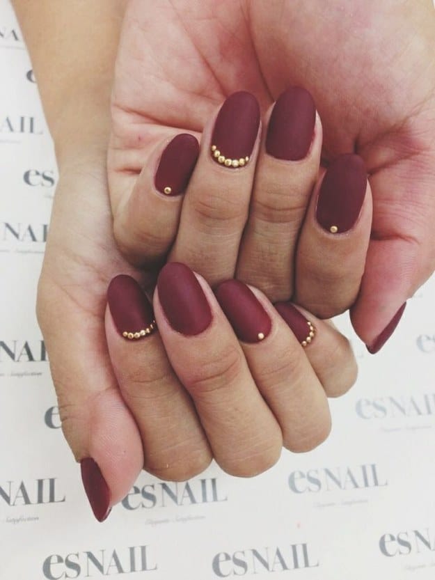 Flat mette burgundy nails with gold dot accents
