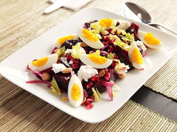 Roasted beet salad with goat cheese, egg, pomegranate, and almonds