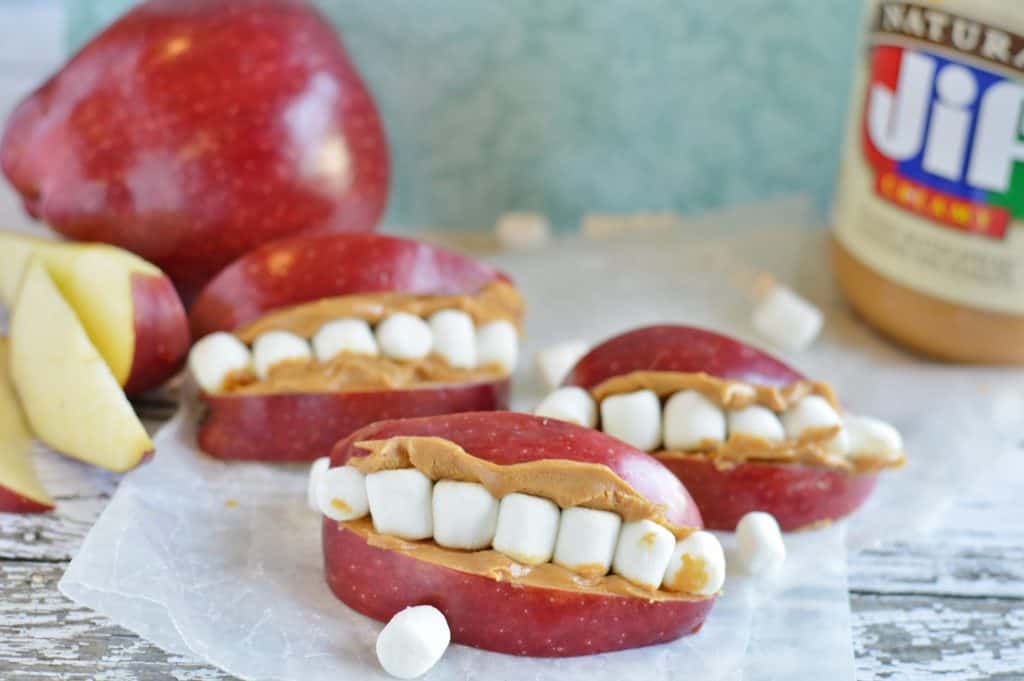 Spooky apple slice, peanut butter, and mini marshmallow snack