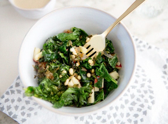 Warm kale salad with carmelized shallots, pine nuts, and apple
