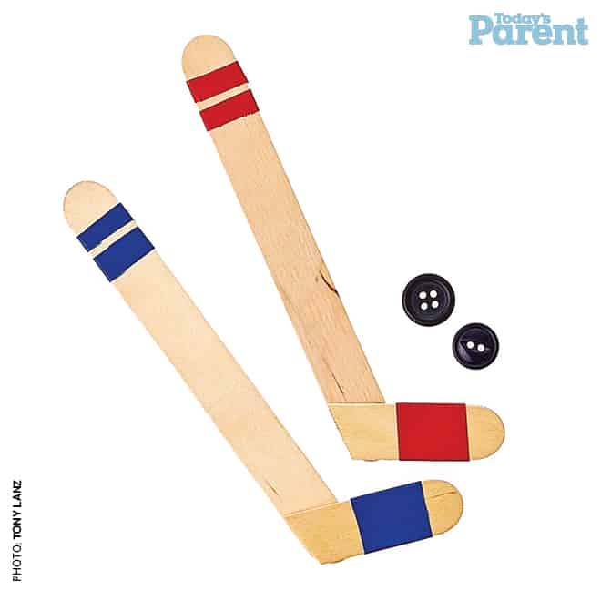Popsicle stick hockey sticks and button pucks
