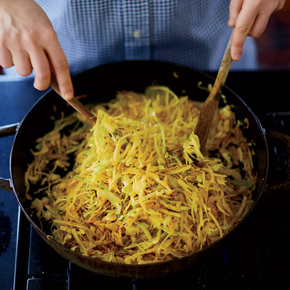 Julia Turshen in the KItchen Prepping the Sauteed Cabbage with Cumin Seeds + A161128 + Food & Wine + Julia Turshen’s New Pantry + February 2017