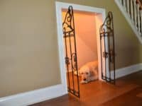 Gated dog house under the stairs 200x150 DIY Staircase Transformation and Storage Projects