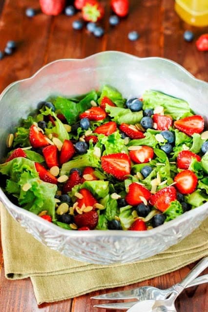 Strawberry, blueberry, and greens salad with honey vinaigrette