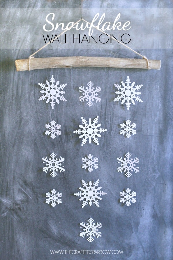 Pretty branch and paper snowflake wall hanging