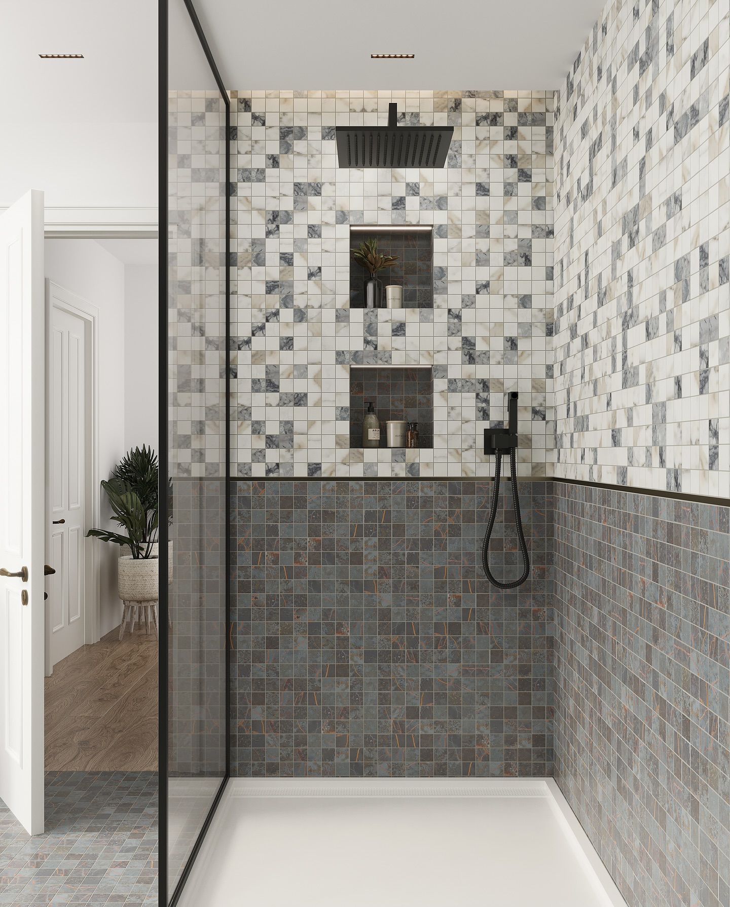 Walk-in shower with a top wall of white marble and gray mosaic squares, a lower wall of dark blue-gray slate mosaic, two inset niches, and matte black rainfall shower and handheld fixtures
